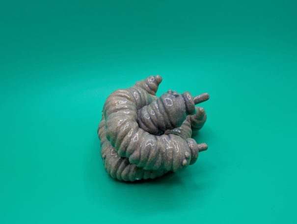 Two intertwined miniature creatures