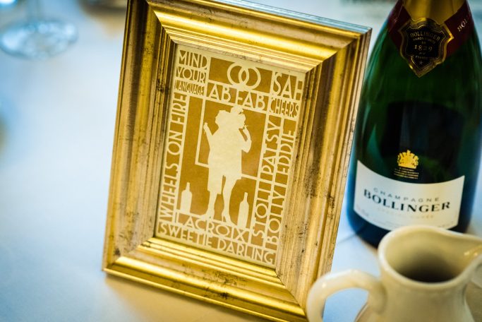 A paper cut Ab Fab design in a gold frame