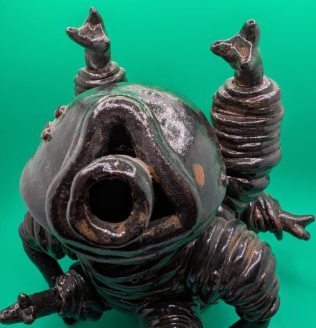 A large standing tardigrade is crouched, tasting the air, as if ready to spring into action if required 