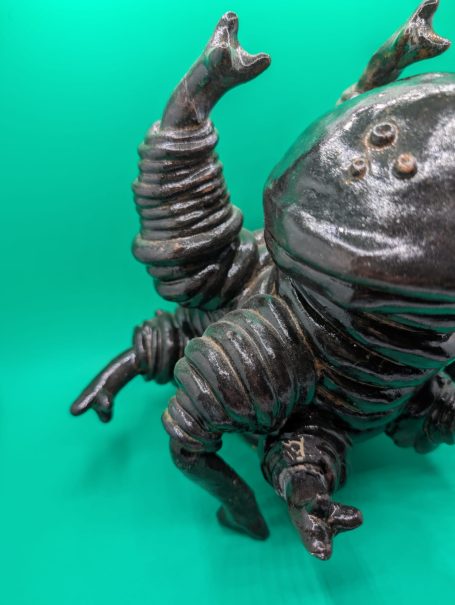A large standing tardigrade is crouched, tasting the air, as if ready to spring into action if required 
