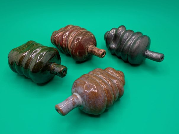 Ceramic sculptures - Four multicoloured 'worm' creatures with proboscis