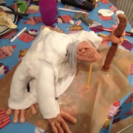 Chocolate clay Mystic wearing a fondant icing robe