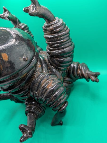 A large standing tardigrade is crouched, tasting the air, as if ready to spring into action if required 